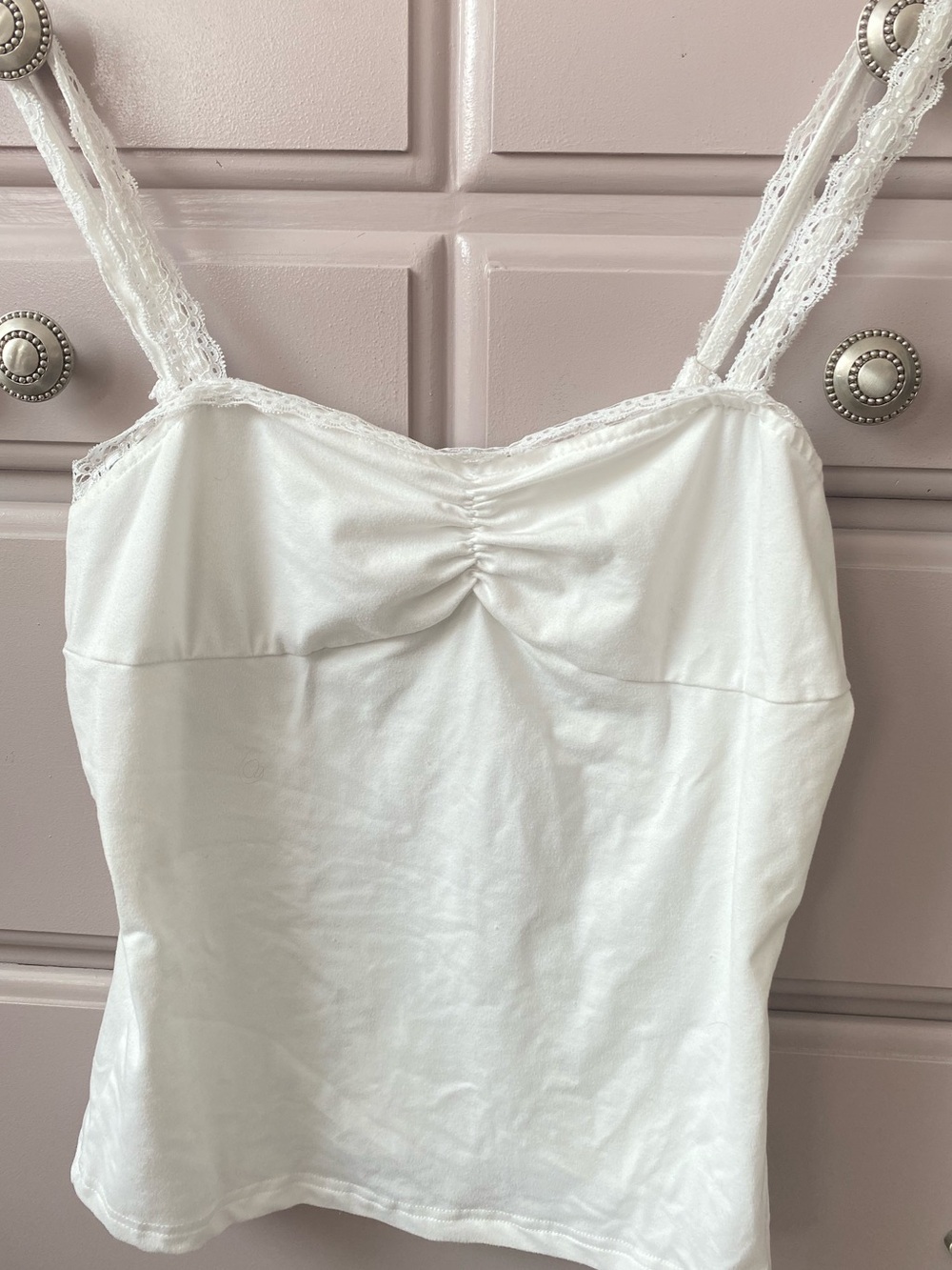 New White cami tank top. Size medium, but no tags adjustable straps.